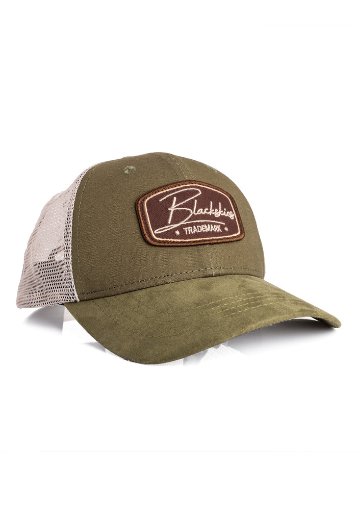 Green trucker cap with a brown patch on a white background