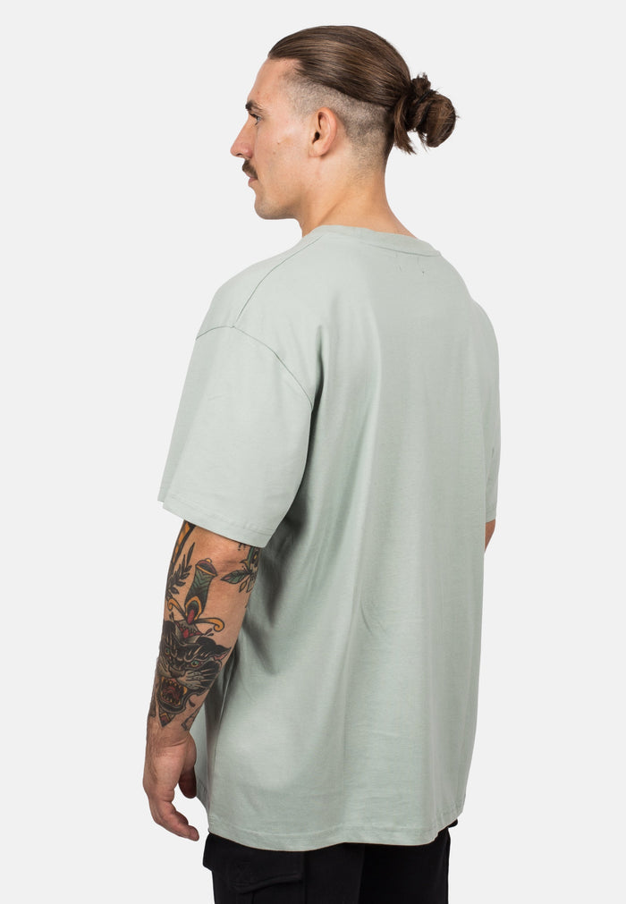 Blackskies-Unisex-Oversized-T-Shirt-Sage-Male-Model-Back
