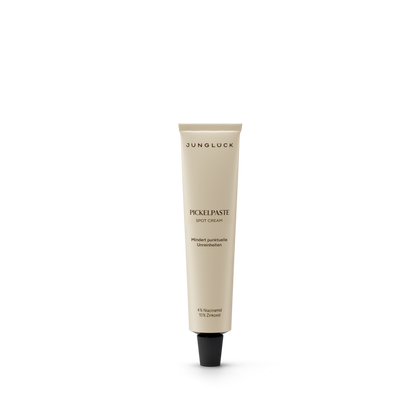 Beige tube of Pickelpaste facial care cream with black cap and minimal text design.