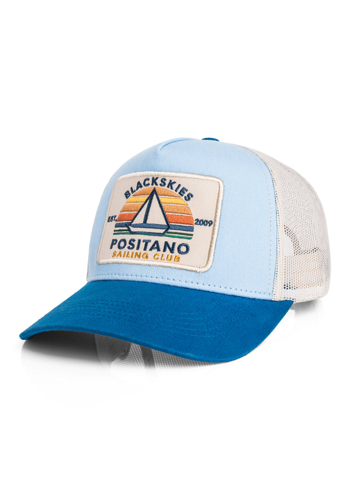 Blue and light blue cap with a patch on a white background