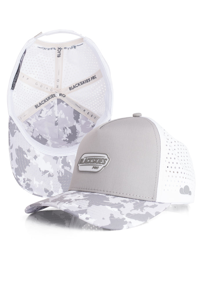 Gray and white camouflage baseball cap with mesh back on a white background