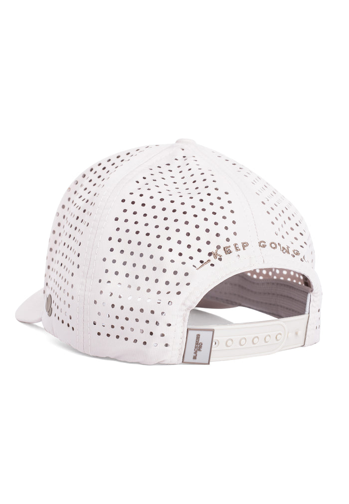 White baseball cap with perforated design on a white background