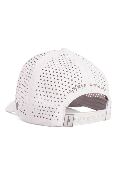 White baseball cap with perforated design on a white background