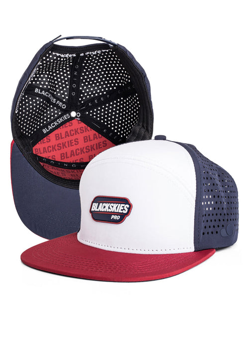 blackskies sport performance snapback hat with white front panel, navy side panel, and red brim on a white background