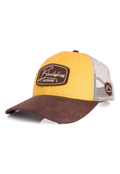 Yellow and brown cap with a visible brand logo on a white background