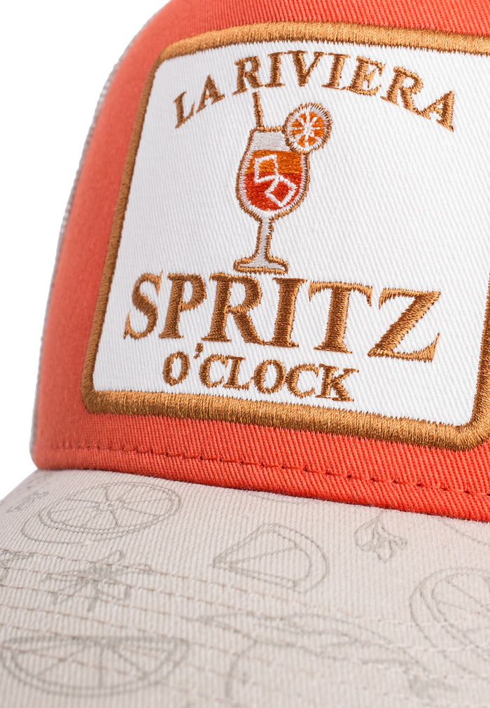 Trucker hat with 'La Riviera Spritz O'Clock' logo on a white background