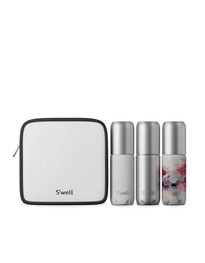 Set of three refillable aluminum travel bottles with leakproof pumps in silver and marbled design, accompanied by a white toiletry bag with black trim for personal care on the go.