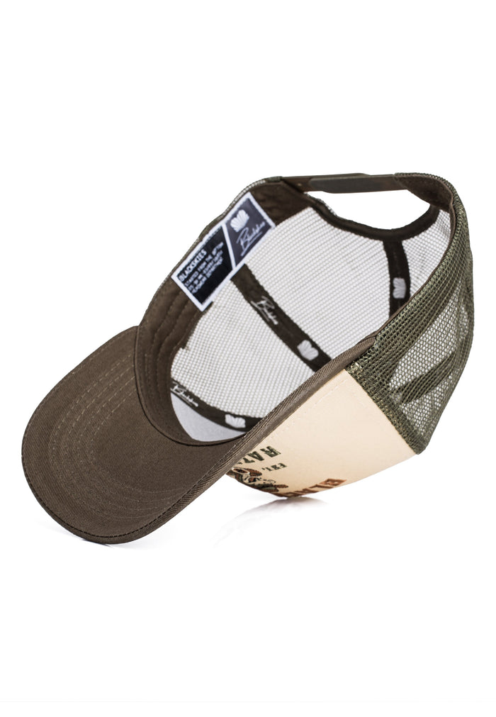 Trucker hat with mesh back and leather brim on a white background